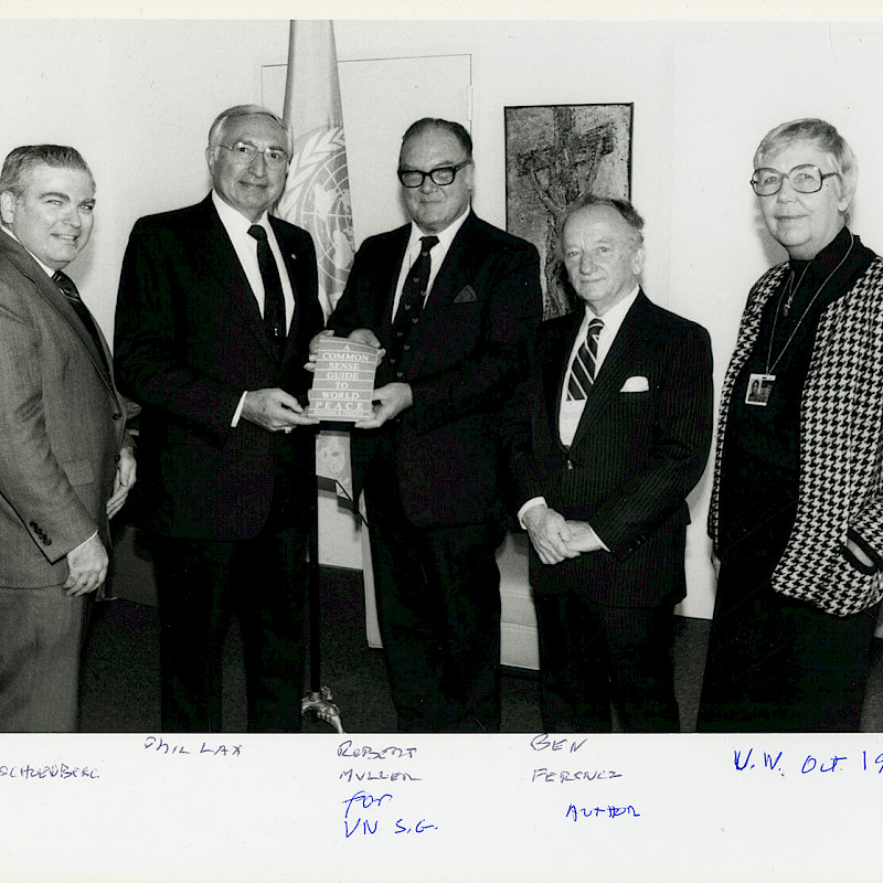 Harris Schenberg, Phil Lax, Robert Muller, and Ben (middle right) posing with "A Common Sense Guide to World Peace" at the United Nations, October 1986