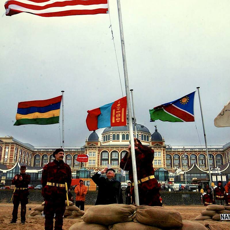 Ben salutes a U.S. flag at the Hague, March 2003
